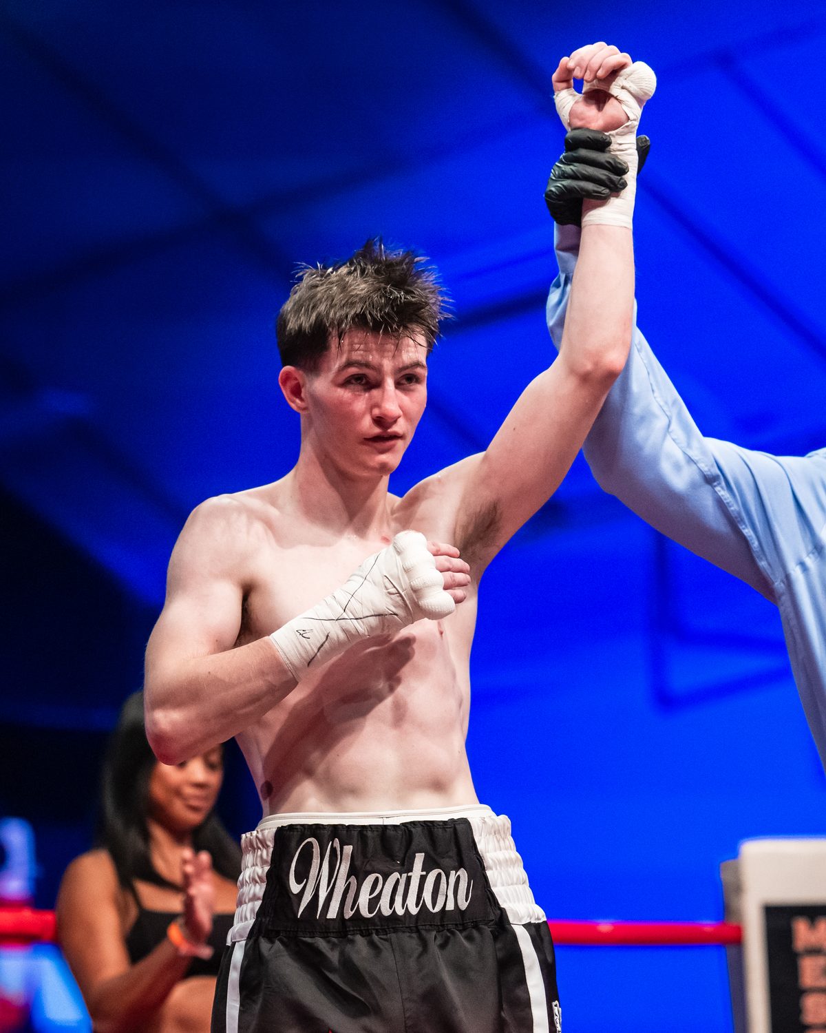 Retias Wheaton with his hand raised in victory