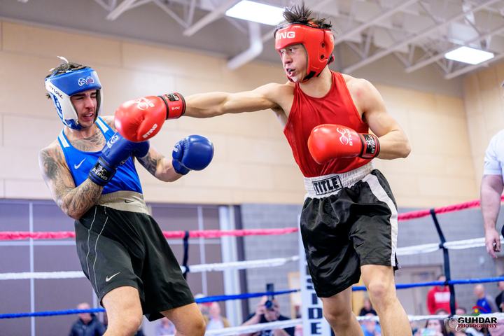A Cougar boxer lands a straight right