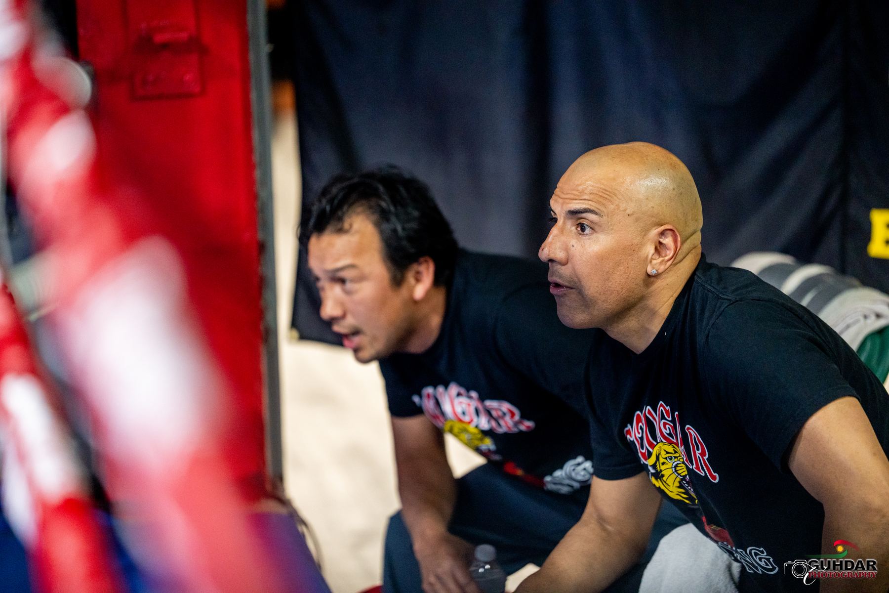 Coaches Ernesto Moreno and Alberto Jerez-Pino watching from ringside